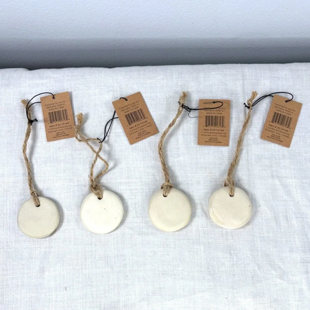 Creative Co-op Ivory Stoneware Tag Ornaments Set of 4 Shine Magic Noel